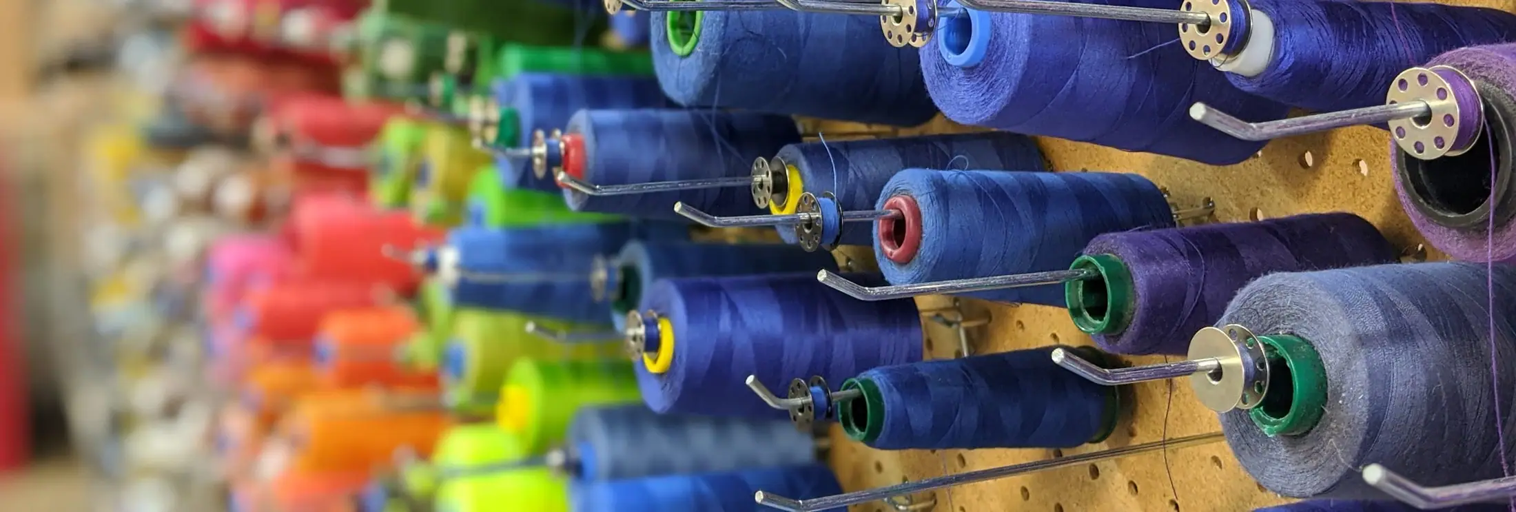 Wall of thread spools in the shop
